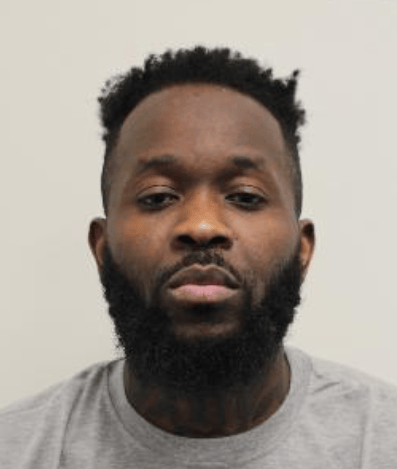 Mugshot of man in grey top
